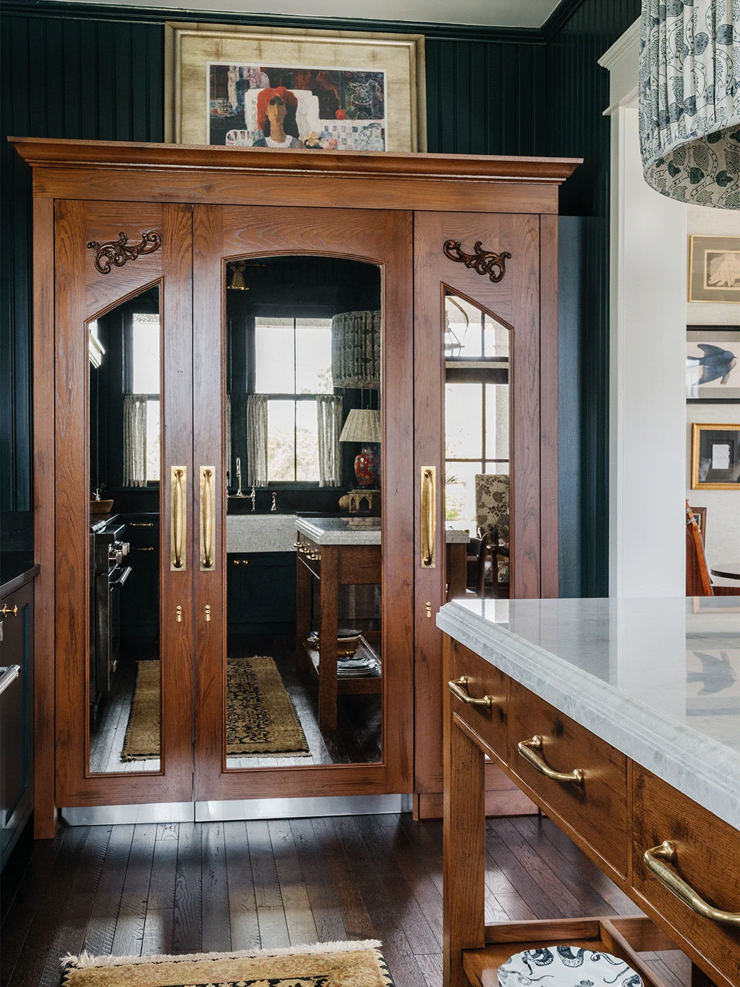 Inside a Florida Kitchen Whose Disguised Armoire Conceals a Refrigerator and a Hidden Pantry Passage