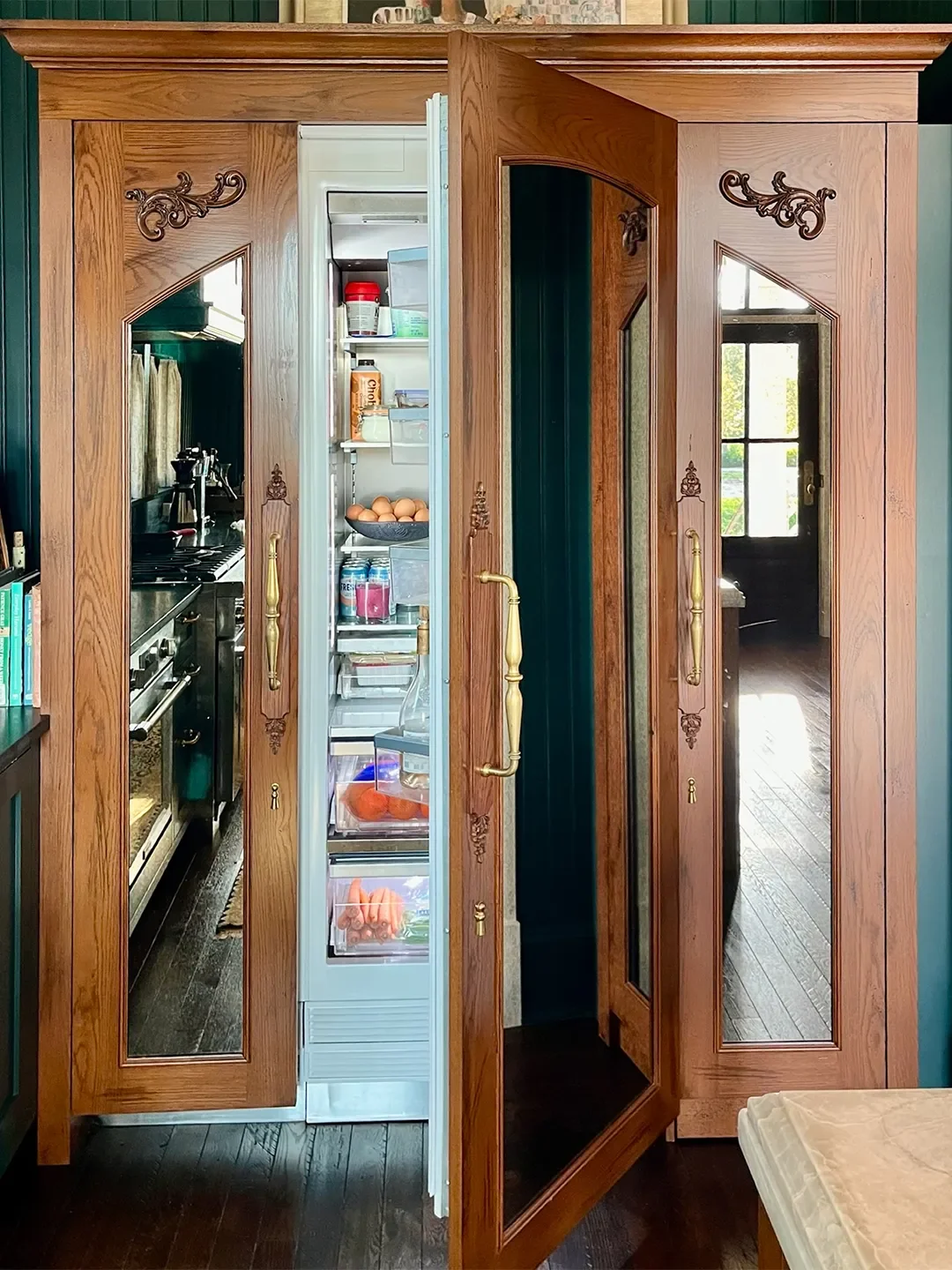 Inside a Florida Kitchen Whose Disguised Armoire Conceals a Refrigerator and a Hidden Pantry Passage